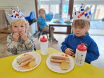 Children at Dickleburgh Pre-School enjoying VE Day lunch